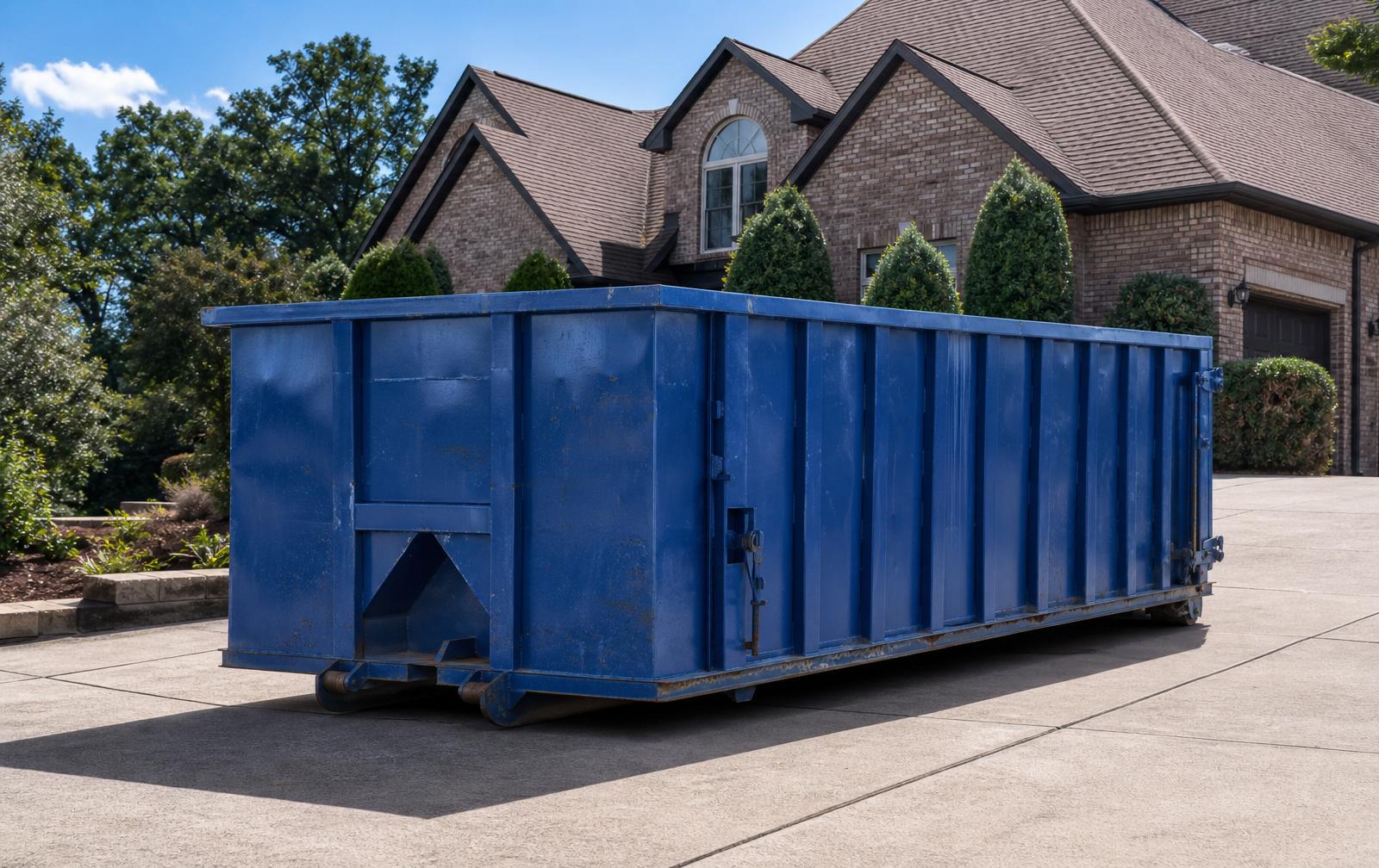 Blue roll-off dumpster delivered to a home in Hoover, AL